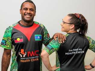 CHARITY'S COSTLY SHIRTS: IWC indigenous health worker, Kane Chapman and medical centre receptionist, Sharnese Mills wearing shirts that are distributed to patients. Picture: Simon Young