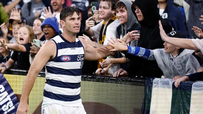 MELBOURNE, AUSTRALIA - APRIL 01: Tom Hawkins of the Cats celebrates with fans after his 350th match during the 2024 AFL Round 03 match between the Hawthorn Hawks and the Geelong Cats at the Melbourne Cricket Ground on April 01, 2024 in Melbourne, Australia. (Photo by Michael Willson/AFL Photos via Getty Images)