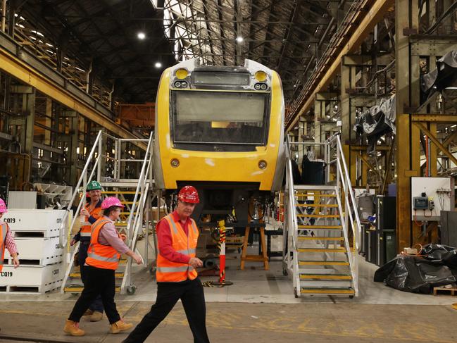 Workers inside the Downer Rail Manufacturing Facility at Maryborough. Picture Lachie Millard