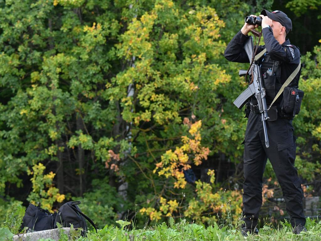 A police officer watches an area near the Porokhovskoye cemetery where Yevgeny Prigozhin was buried in Saint Petersburg. Picture: AFP