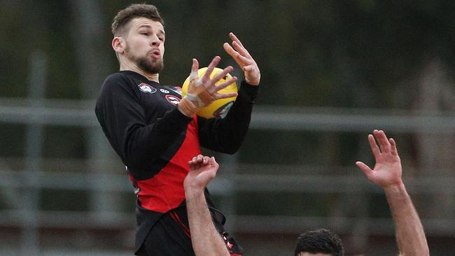 Tim Currie flies for a mark. Picture: Hamish Blair