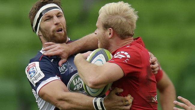 Lions star Ross Cronje takes no prisoners as he charges into the Rebels defence.