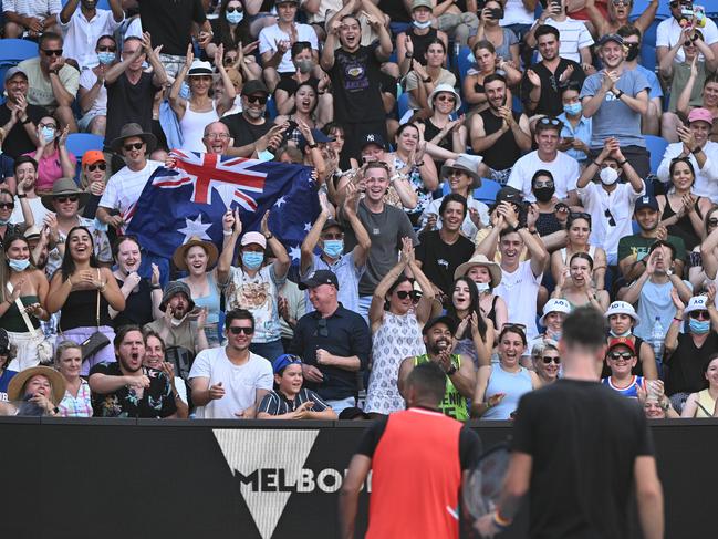 MELBOURNE, AUSTRALIA - JANUARY 23: Fans cheer during the third round doubles match between Thanasi Kokkinakis of Australia and Nick Kyrgios of Australia against Ariel Behar of Uruguay and Gonzalo Escobar of Ecuador during day seven of the 2022 Australian Open at Melbourne Park on January 23, 2022 in Melbourne, Australia. (Photo by Quinn Rooney/Getty Images)