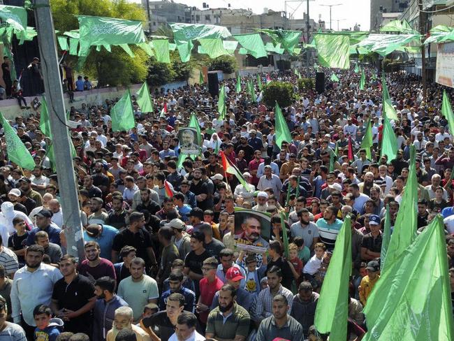 Supporters of the Palestinian Hamas movement hold a rally against Israel and in support of Jerusalem's Al-Aqsa Mosque, in Khan Yunis in the southern Gaza Strip on October 14, 2022. (Photo by SAID KHATIB / AFP)