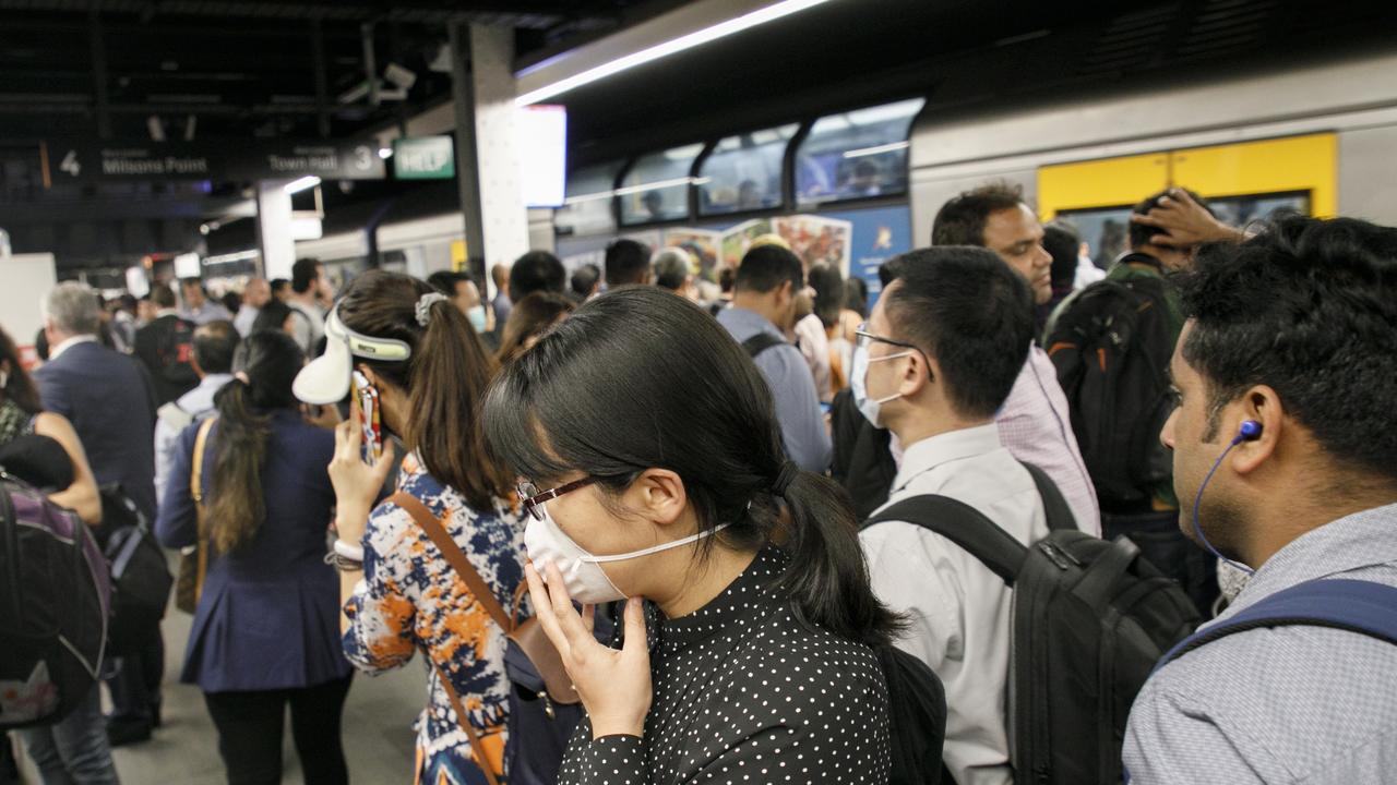 Mask are commonly now being worn around the Sydneys CBD due to the fear of the Coronavirus. Photo: Tim Pascoe