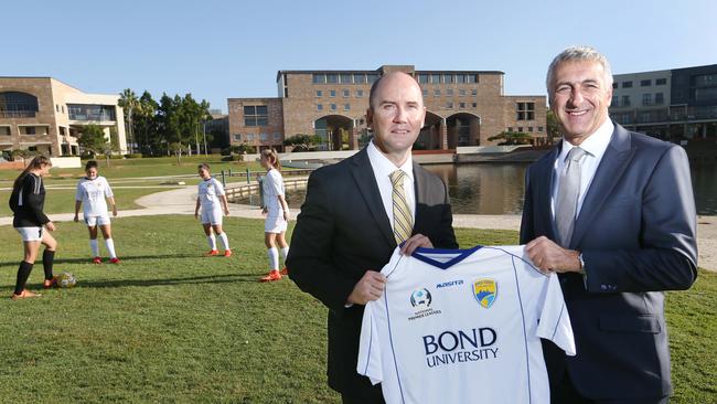 Troy Bingham with Bond University head of sport Garry Nucifora. Picture: Glenn Hampson