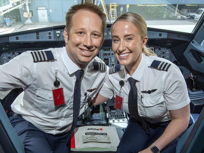 Jetstar pilots  Matthew Wills and Rachel Blair-Wills who met at work and now are married and fly together get into Valentines Day mood in the cockpit of a Jetstar Aircraft  at Adelaide Airport .Thursday,February,13,2025.Picture Mark Brake