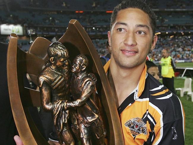 Benji Marshall poses with the trophy after winning the NRL Grand Final between the Wests Tigers and the North Queensland Cowboys in 2005. Picture: Cameron Spencer/Getty Images