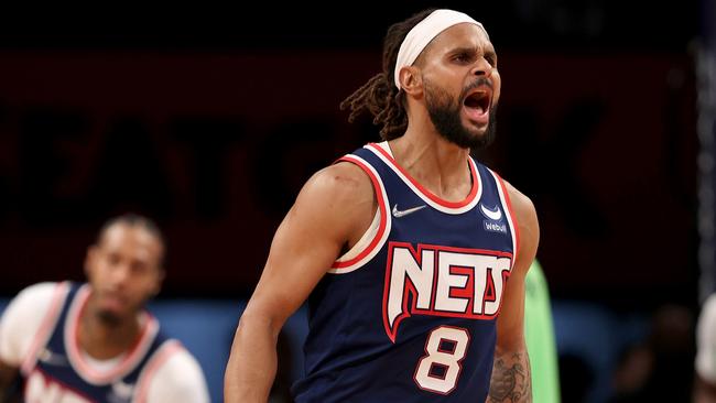 NEW YORK, NEW YORK - DECEMBER 03: Patty Mills #8 of the Brooklyn Nets celebrates his shot late in the fourth quarter against the Minnesota Timberwolves at Barclays Center on December 03, 2021 in the Brooklyn borough of New York City. The Brooklyn Nets defeated the Minnesota Timberwolves 110-105. NOTE TO USER: User expressly acknowledges and agrees that, by downloading and or using this photograph, User is consenting to the terms and conditions of the Getty Images License Agreement. (Photo by Elsa/Getty Images)