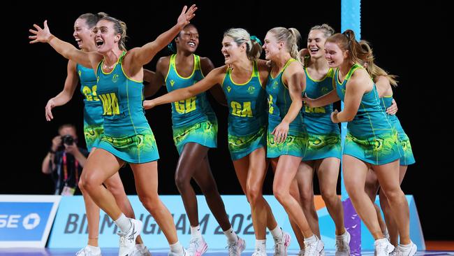 Gretel Bueta, fourth from the left, and her fellow Diamonds celebrate beating Jamaica and winning Australia’s 1000th Commonwealth Games gold medal. Picture: Getty Images