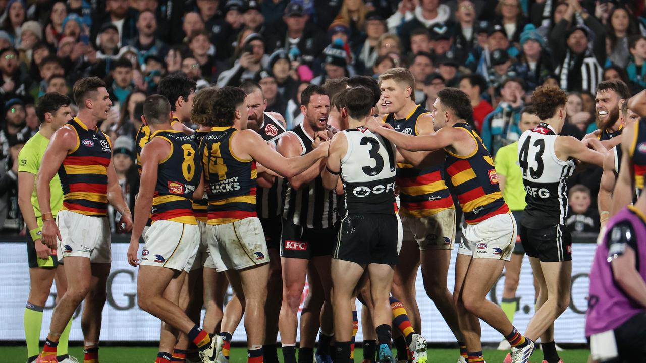 ADELAIDE, AUSTRALIA - AUG 17: The Power and Crows clash after Izak Rankine of the Crows is injured during the 2024 AFL Round 23 match between the port Adelaide Power and the Adelaide Crows at Adelaide Oval on August 17, 2024 in Adelaide, Australia. (Photo by James Elsby/AFL Photos)