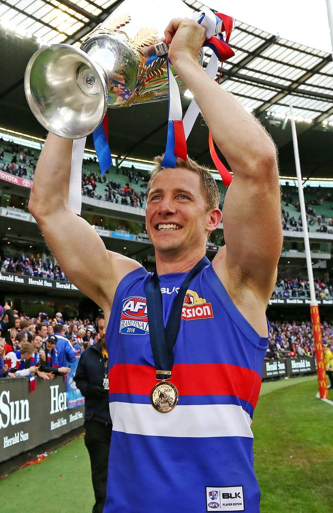 Dale Morris holds the premiership cup aloft after the Bulldogs’ Grand Final victory. Picture: Mark Stewart