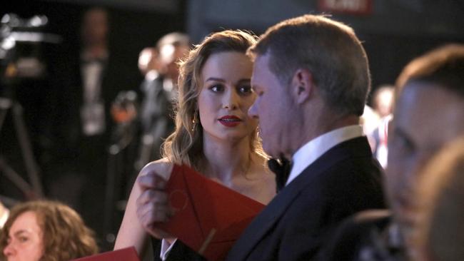 Brie Larson, left, being handed the best actor envelope by Brian Cullinan backstage before the mayhem. Picture: AP