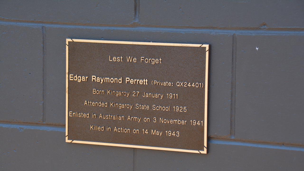 The first plaque on the KSHS war memorial wall is for Edgar Raymond Perrett at the 2019 Kingaroy Remembrance Day service at KSHS. (Photo: Jessica McGrath)