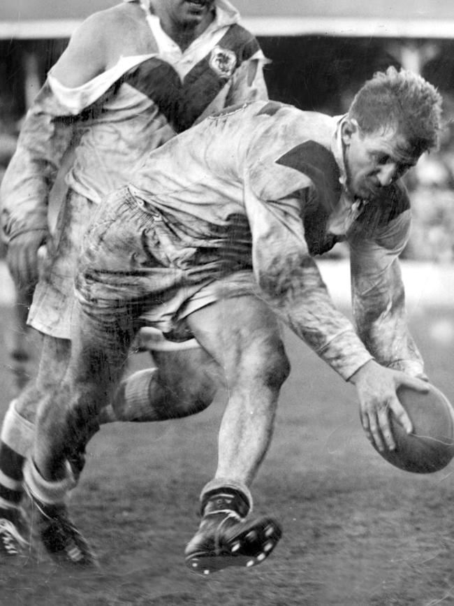 Johnny Raper goes over for a try as Brian Clay looks on in 1959.