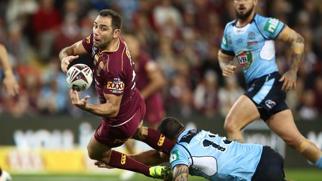 Cameron Smith gets an offload away for the Maroons.