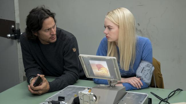 Cary Fukunaga with actress Emma Stone on the set of Netflix series Maniac.