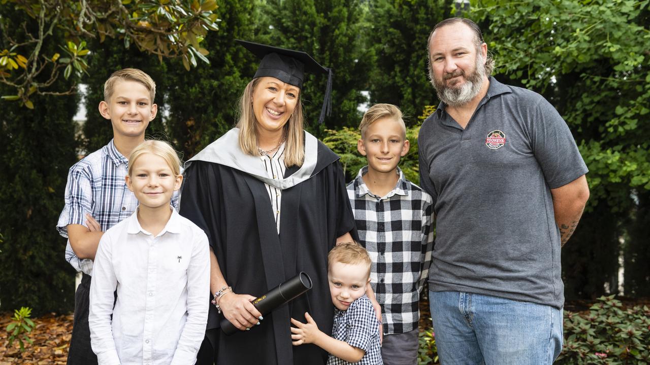 Master of Business and Master of Professional Accounting graduate Melissa Rogers with family (from left) Ryan Ballini, Imogen Ballini, Cole Rogers, Cooper Ballini and Craig Rogers at the UniSQ graduation ceremony at Empire Theatres, Tuesday, December 13, 2022. Picture: Kevin Farmer