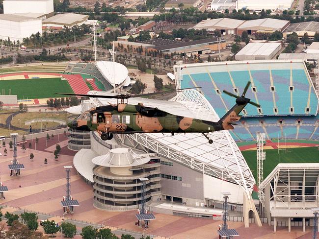 Sydney 2000 Olympics anti-terrorism exercises. A Black Hawk helicopter flies over Stadium Australia at Homebush. Picture: Bruce Long.