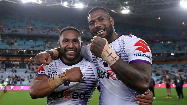 Suliasi Vunivalu (right) celebrates after the grand final. Picture: Cameron Spencer/Getty Images