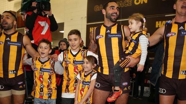 Shaun Burgoyne sings the song with his kids after the win in his 350th game. Picture: Michael Klein