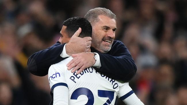 LONDON, ENGLAND - DECEMBER 10: Ange Postecoglou, Manager of Tottenham Hotspur, embraces Pedro Porro after teammate Richarlison (not pictured) scores their team's third goal during the Premier League match between Tottenham Hotspur and Newcastle United at Tottenham Hotspur Stadium on December 10, 2023 in London, England. (Photo by Justin Setterfield/Getty Images)