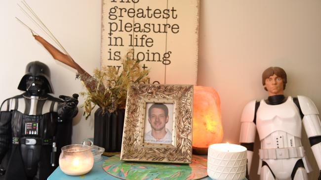 A photo of Mark at Dale's home with candles and Star Wars characters. Picture: Jason Sammon