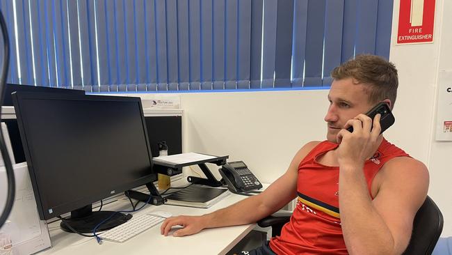 The reduced capacity means 15 per cent of Adelaide’s reserved seat members will lose their regular spot. Rory Laird hits the phones. Picture: Adelaide Crows/Twitter