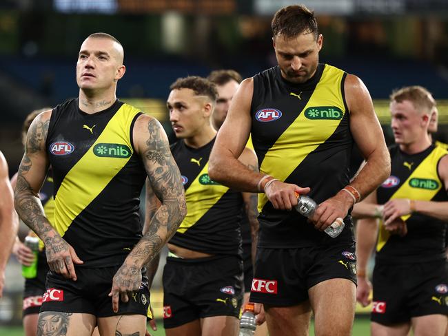 Dustin Martin and Toby Nankervis walk off the MCG on Saturday night. Picture: Quinn Rooney/Getty Images