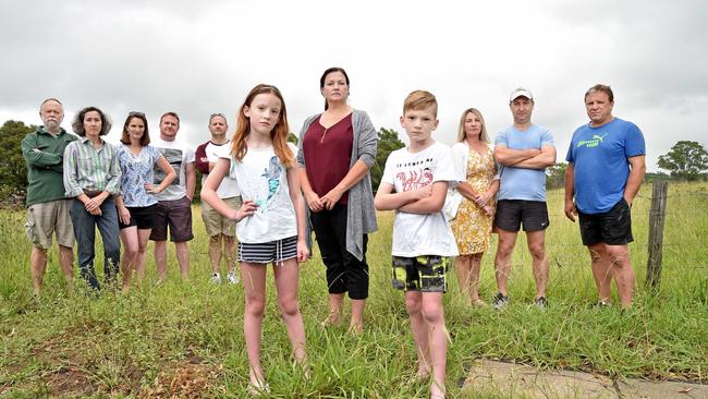 Concerned Mile End Rd residents Rob and Andrea McFarlane, Carol and John Van De Maele, Dr David Anger, Emily Van De Maele, 8, Kelly Zammit, David Van De Maele, 11, Cayleen Gualterio, Michael Lambert and Neil Poullos at Rouse Hill. Picture: AAP IMAGE / Troy Snook