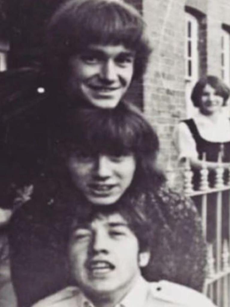 The three Easybeats members in front of the house with eldest sister Margaret Young in the background. Picture: Jill Molan