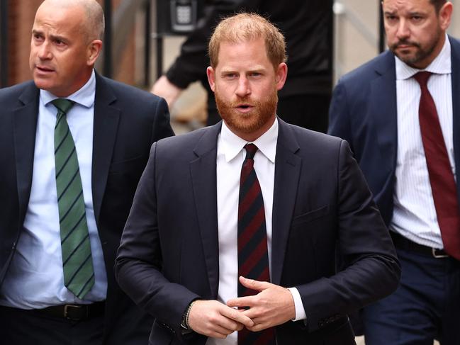 Prince Harry, Duke of Sussex walks with a security detail as he arrives at the Royal Courts of Justice, Britain's High Court, in central London in April. Picture: AFP