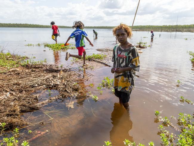 Gapuwiyak children play by Lake Evella, which sits on the edge of the community, in northeast Arnhem Land.