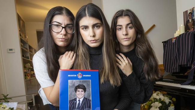 Kristina, Elpida and Georgia Tsindos with a photo of their brother James, who died after suffering an anaphylactic reaction. Picture: Wayne Taylor