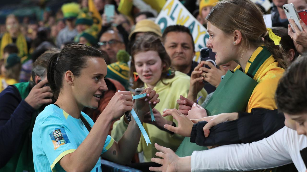 Matildas star Hayley Raso gives her ribbon to a supporter in the crowd at last year’s World Cup. Picture: Adam Head