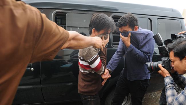 Two Indonesian men arrive for their trials at a sharia court in Banda Aceh on May 17. Picture: Chaideer Mahyuddin/AFP