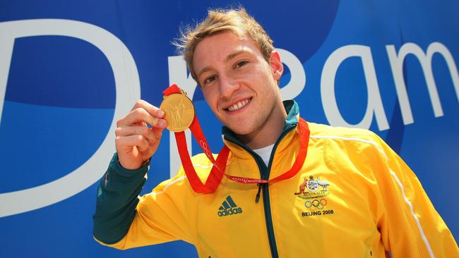 Matthew Mitcham parades his gold medal from the diving at the 2008 Beijing Olympics.