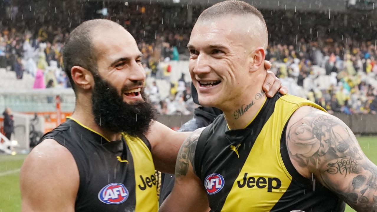 Bachar Houli of the Tigers (L) celebrates the win with Dustin Martin during the Round 22 AFL match between the Richmond Tigers and the West Coast Eagles at the MCG in Melbourne, Sunday, August 18, 2019. (AAP Image/Michael Dodge) NO ARCHIVING, EDITORIAL USE ONLY