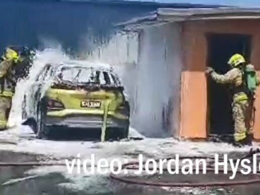 Firefighters put out the fire in a still from video shot by Jordan Hyslop.