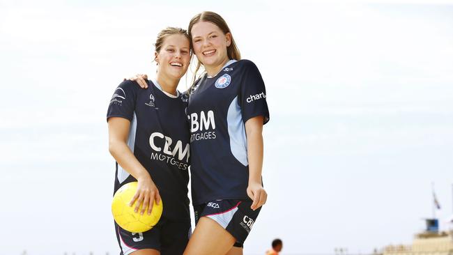 Dunbar Rovers U17 players Chloe Finch, 16, and Macy Moore, 15, at a training session on Clovelly Beach. Picture: John Appleyard