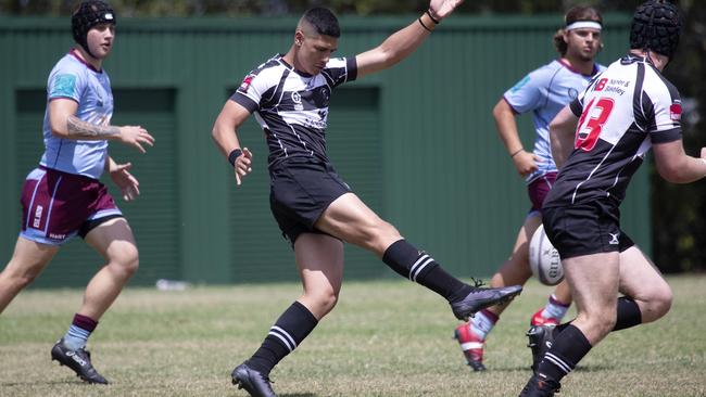 Souths no.12 Tau Tuisamoa kicks ahead for a try.(Image Sarah Marshall)