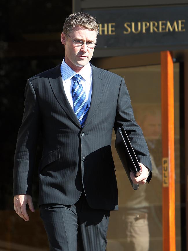 Former ABC television (TV) host Andy Muirhead, 35, leaves the court after facing charges.