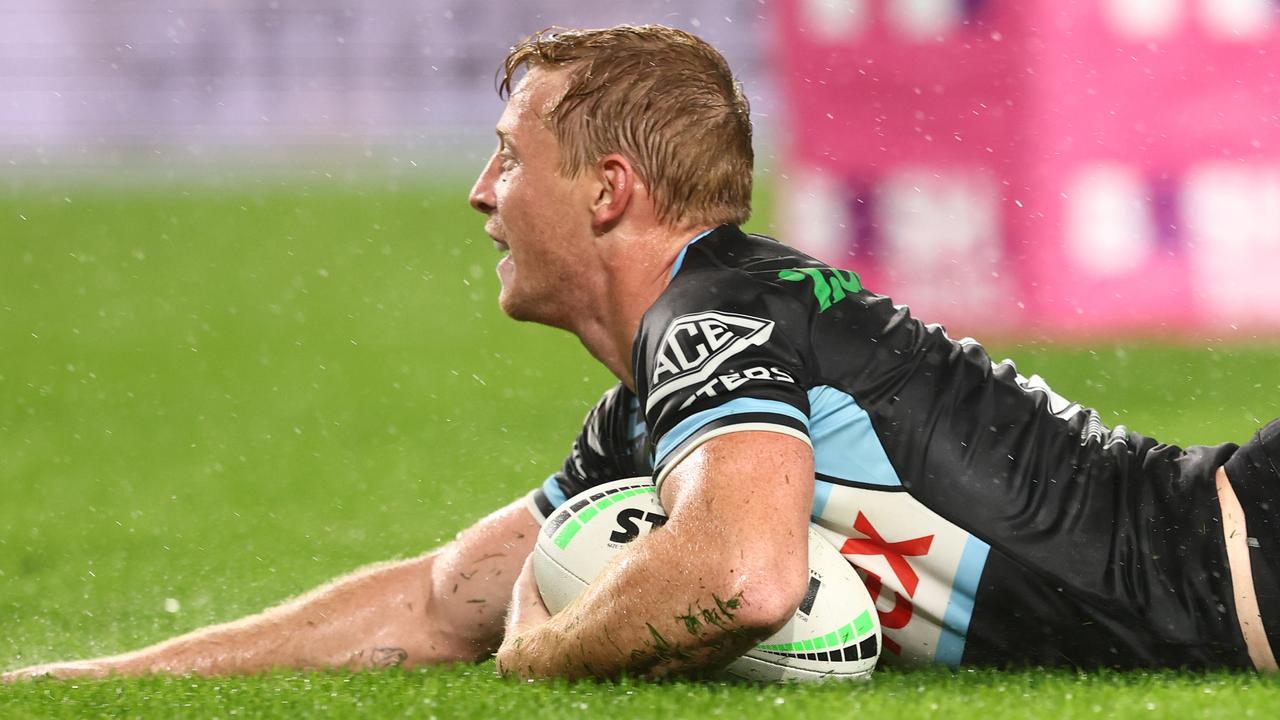 GOLD COAST, AUSTRALIA - MAY 22: Lachlan Miller of the Sharks scores a try during the round 11 NRL match between the Gold Coast Titans and the Cronulla Sharks at Cbus Super Stadium, on May 22, 2022, in Gold Coast, Australia. (Photo by Chris Hyde/Getty Images)