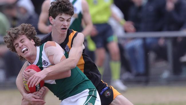 Grovedale’s Samuel Walker (right) tackles Bell Park’s Euriah Hollard. Picture: Mark Wilson
