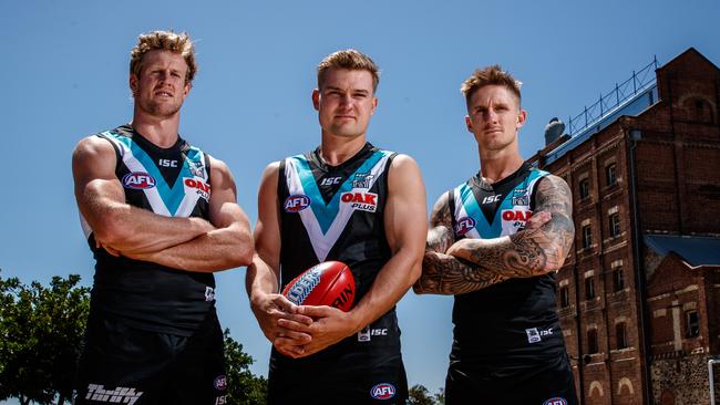 Port Adelaide's co-captains Tom Jonas and Ollie Wines with deputy Hamish Hartlett at Harts Mill, Port Adelaide. Picture: Matt Turner