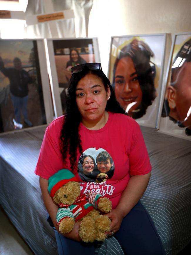 Angelina Kauffman is pictured in her son Ernesto’s bedroom, where her daughter sleeps surrounded with photos of her siblings. Crosses used at the grave site also rest on the bed. Picture: Jeff Darmanin