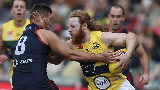 Angus Poole runs into a Mitch Grigg roadblock. Picture Sarah Reed