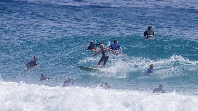 Surfers having to ride through other surfers as large swell brings large crowds to Snapper Rocks on Sunday 2 January 2022. Picture: Jerad Williams