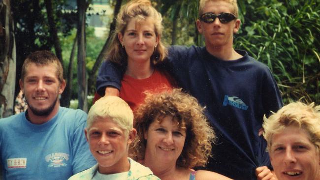 Mick Fanning, centre, with his family in the early 1990s. Picture: Supplied