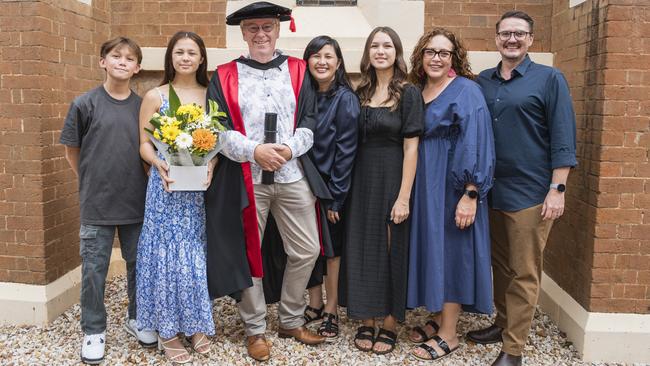 Doctor of Philosophy graduate Nick Todd with family and friends (from left) Daniel Todd, Sophie Todd, Kim Todd, Jodie Todd, Annelize Mulder and Coenraad Mulder at a UniSQ graduation ceremony at Empire Theatres, Tuesday, February 13, 2024. Picture: Kevin Farmer